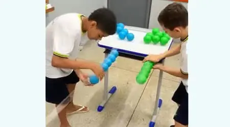 Remice the colored plastic balls on the adhesive tape